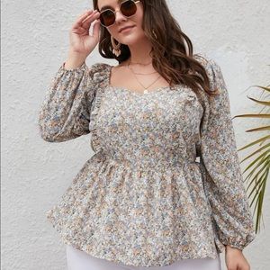 Long sleeve peplum blouse with floral design
